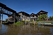 Inle Lake Myanmar. All the buildings are constructed on piles. Residents travel around by canoe, but there are also bamboo walkways and bridges over the canals, monasteries and stupas.